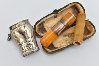 TWO CHEROOTS AND A VESTA, the first an amber cheroot with a rose metal collar, together with case,