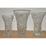 THREE LARGE CUT CRYSTAL VASES, of different designs, no noticeable maker's marks, tallest 34cm (