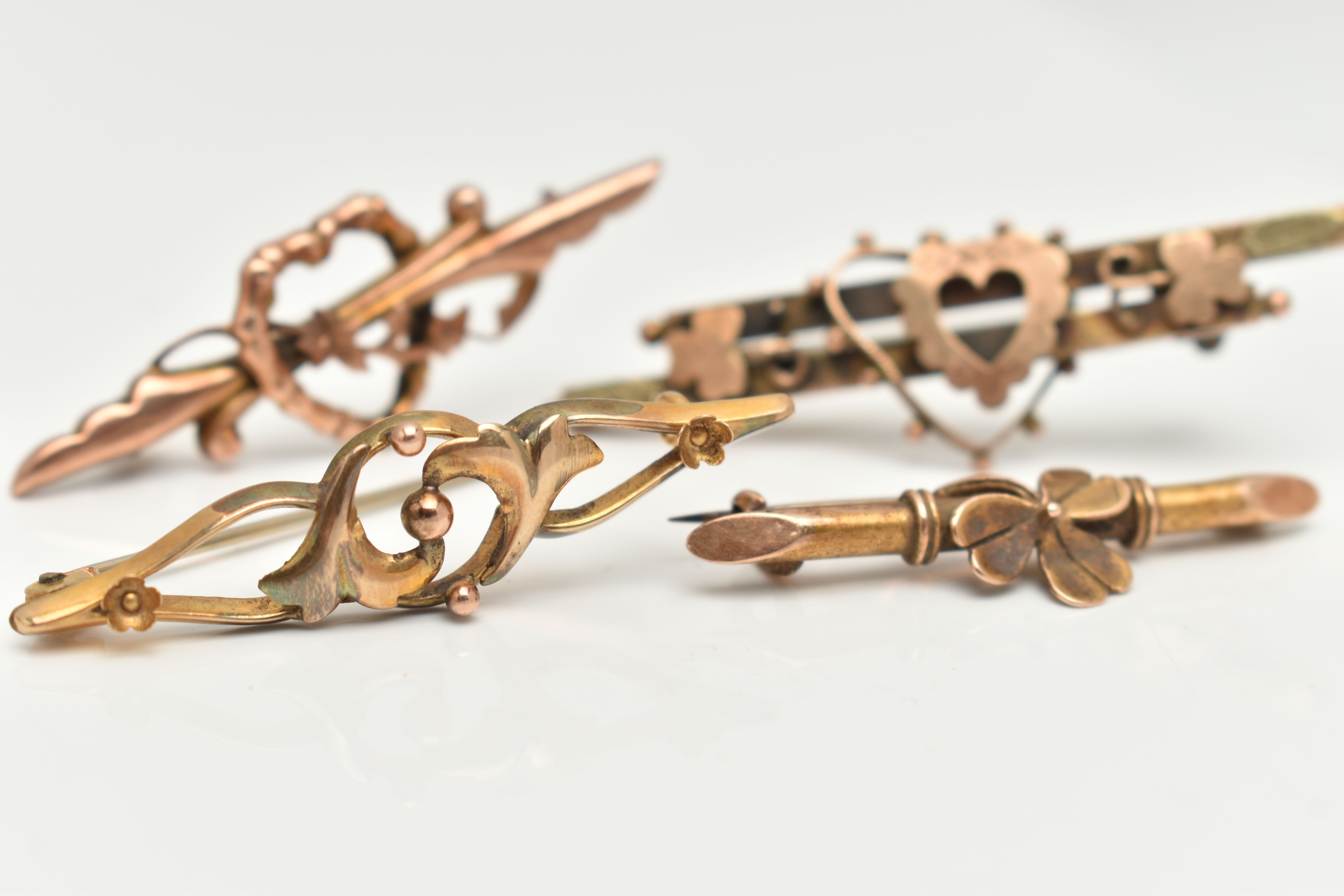 FOUR EARLY 20TH CENTURY BAR BROOCHES, the first a 9ct gold bar brooch with open heart detail, - Image 2 of 5