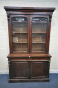 A VICTORIAN MAHOGANY BOOKCASE, with a loose cornice, double glazed doors enclosing three shelves,