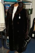 A VINTAGE LADIES DARK BROWN COAT, with a brown fur collar, covered buttons, embroidered satin