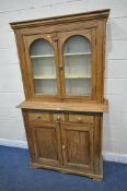 A 19TH CENTURY PINE BOOKCASE, the double glazed doors, enclosing two shelves, above three drawers