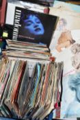 A BOX AND A CASE OF SINGLES RECORDS, approximately one hundred and eighty singles, by artists to