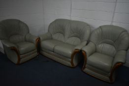 A GREEN LEATHER THREE PIECE LOUNGE SUITE, comprising a small two seater settee, length 143cm, and