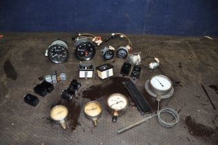 A TRAY CONTAINING VINTAGE CAR PARTS AND DIALS including rev counter, oedometer, volt and fuel