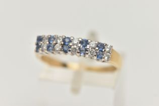 A GEM SET RING, a double row of round brilliant cut diamonds and round cut blue sapphire, prong