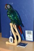 A BOXED SWAROVSKI CRYSTAL BIRDS OF PARADISE 'MACAW CHROME GREEN' SCULPTURE, model no 685824, on a