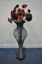 A GOTHIC STYLE LAMP, in the form of a vase holding black and red flowers, approximate height