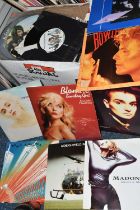 TWO BOXES OF RECORDS, to include over one hundred singles by artists including REM, Duran Duran,