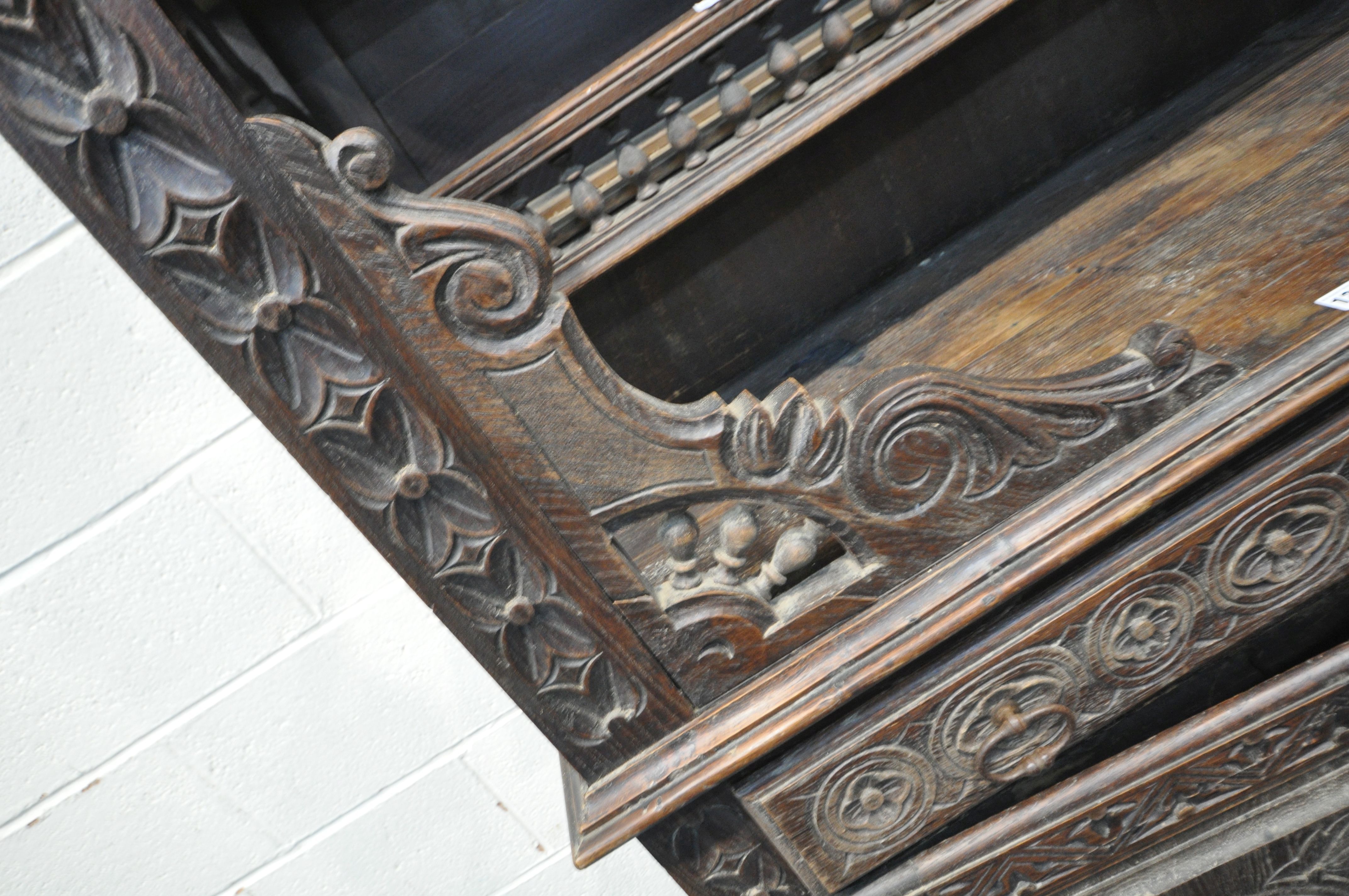 A TALL HARDWOOD WALL CABINET, with a variety of intricate carved designs, consisting of spindles, - Image 5 of 10