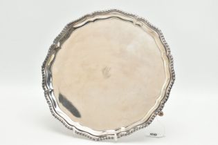 A GEORGE V SILVER SALVER OF CIRCULAR FORM, gadrooned rim, pie crust border, engraved with 'C' to the