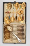 TWO SETS OF DANISH SPOONS, to include a set of eight yellow metal teaspoons, decorated with a