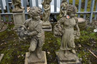 TWO WEATHERED GARDEN FIGURES, of a boy and girl, max height 75cm (condition report: no cracks or