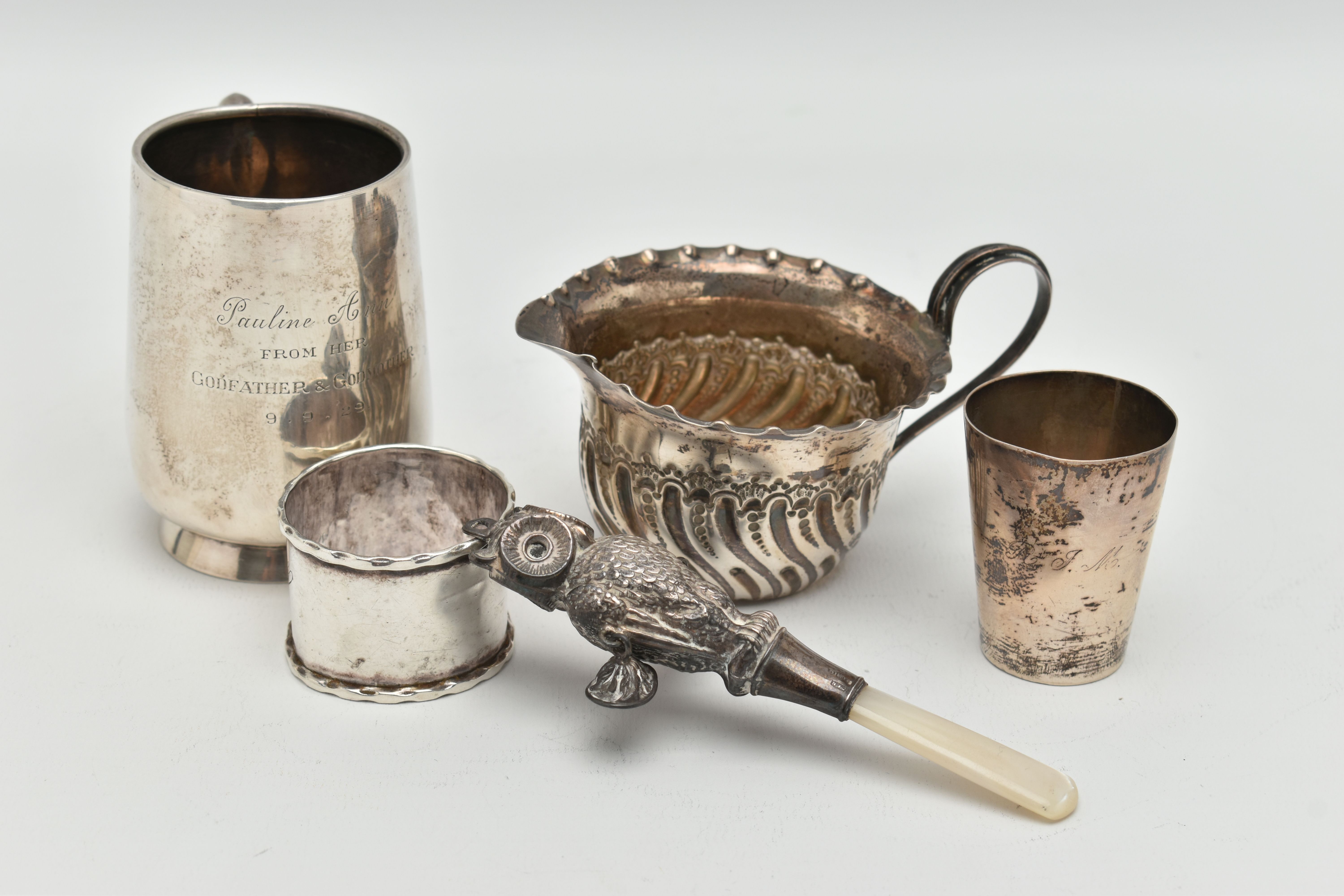 FIVE ITEMS OF SILVER, to include a silver christening cup, personal engraving reads 'Pauline Ann