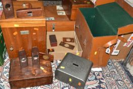 A GROUP OF EMPTY WOODEN INSTRUMENT CASES, comprising seven assorted cases, a brown leather AVO case,