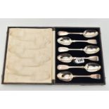 A CASE CONTAINING A MATCHED SET OF VICTORIAN FIDDLE PATTERN DESSERT SPOONS, five maker Henry