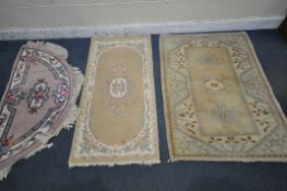 THREE VARIOUS CHINESE WOOLEN RUGS, to include a rectangular rug, with repeating geometric patterns