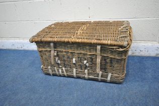 A WICKER BASKET, with a hinged lid and two closing belts, width 81cm x depth 54cm x height 58cm (