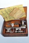 A WATCHMAKER'S LATHE, by Ime of London, in a fitted wooden case with instructions and accessories,