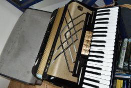 A CASED HOHNER VIRTUOLA III 'PIANO ACCORDION', in black finish with 120 bass and 5 treble