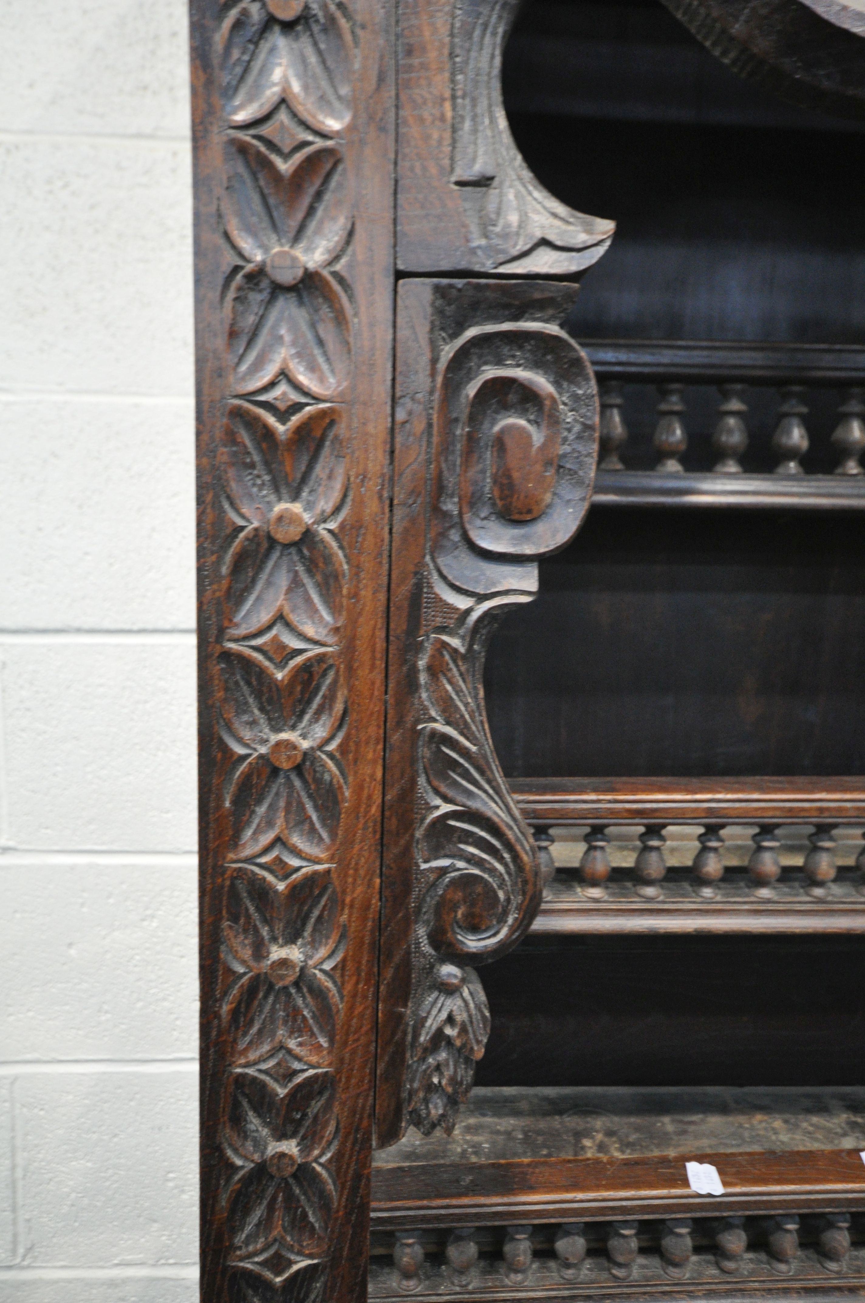 A TALL HARDWOOD WALL CABINET, with a variety of intricate carved designs, consisting of spindles, - Image 4 of 10