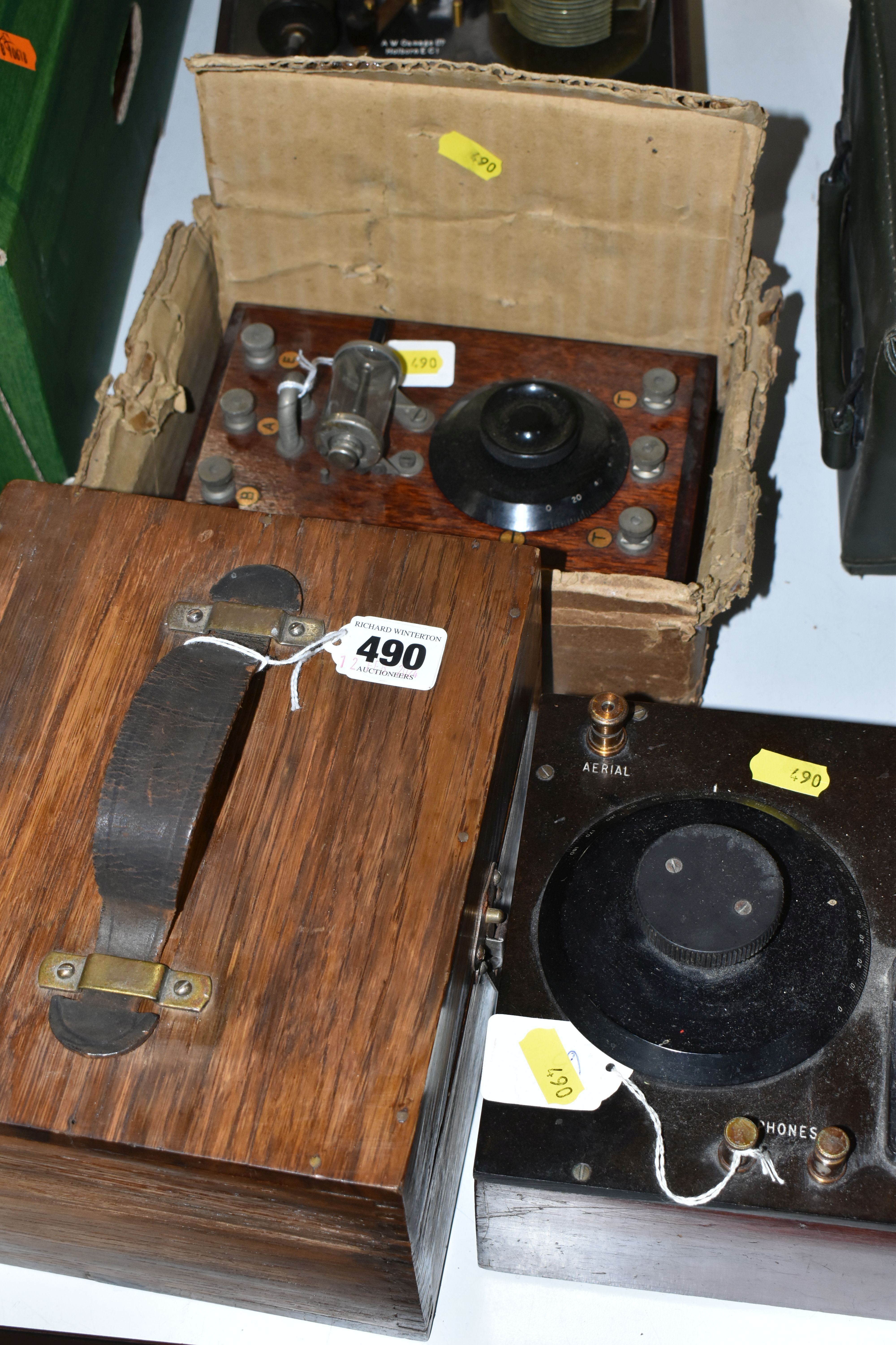 A GROUP OF FOUR CRYSTAL RADIO RECIEVING SETS, comprising a hinged wooden case containing an A.W