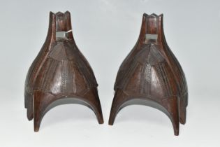 A PAIR OF WOODEN STIRRUPS, carved with patterns, each with six wooden 'legs', approximate