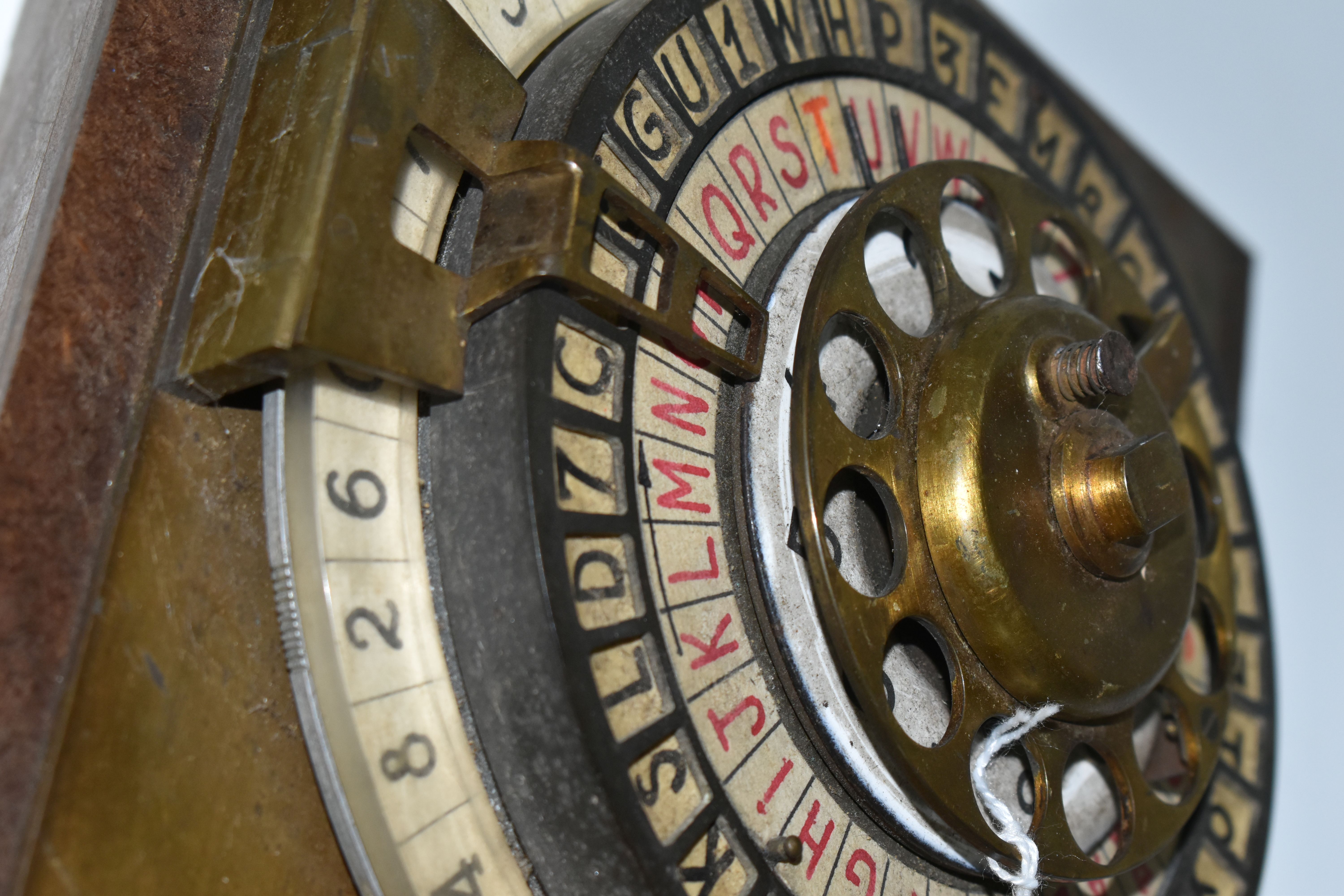 A SCRATCHBUILT DISK CIPHER/CODING MACHINE, with four wheels of letters and numbers, on an angled - Image 6 of 7