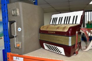A HOHNER TWENTY-SIX KEY PIANO ACCORDION, 'Starlet 40' model with hard case, untested