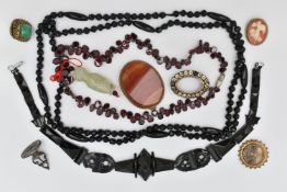 A SMALL BAG OF JEWELLERY, to include a carved Jet bead bracelet, fitted with a lobster clasp, a