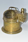 A BRASS CASED BINNACLE COMPASS, marked Mercantile Stores Ltd to dial, the brass case with glass