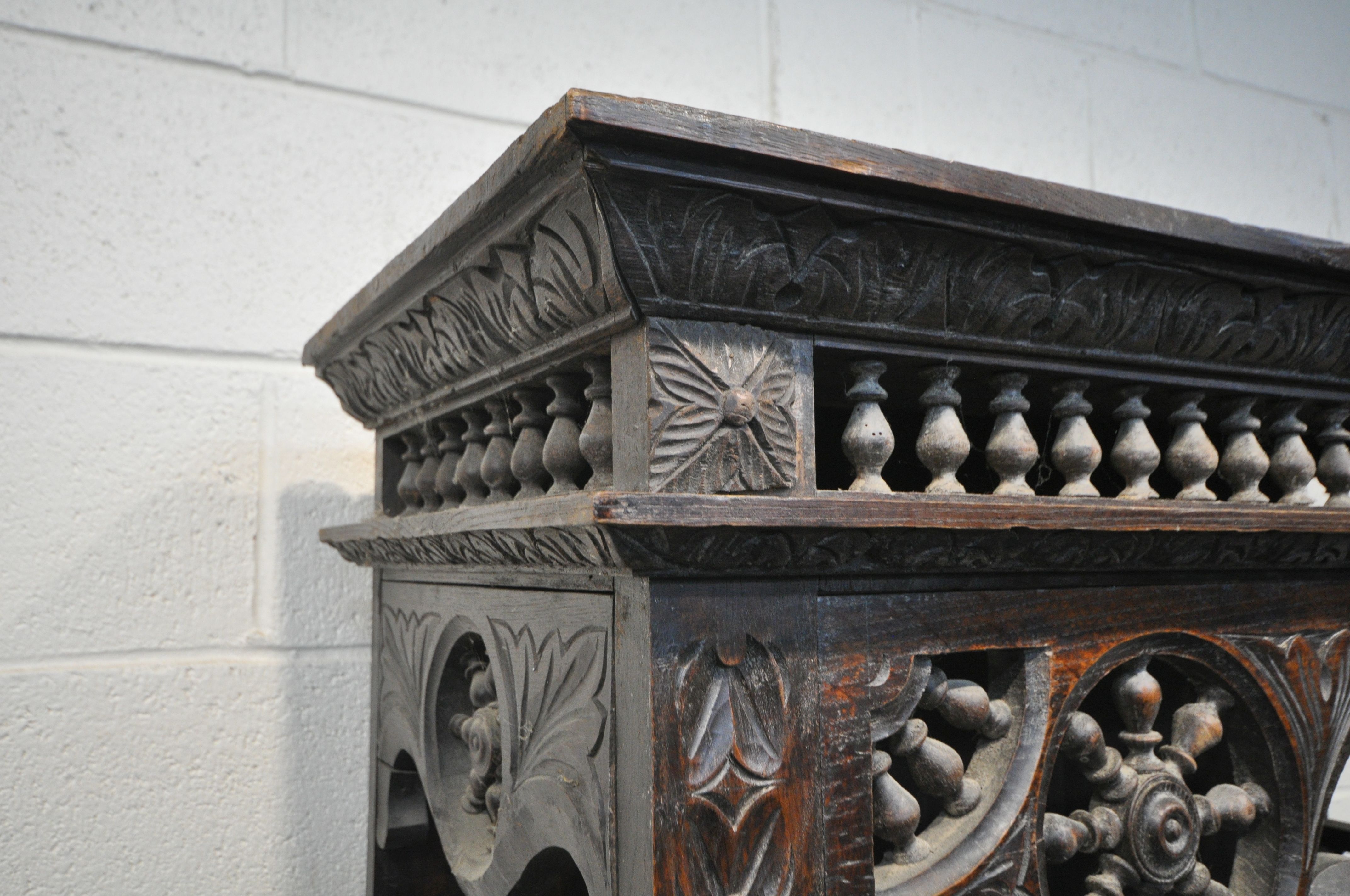 A TALL HARDWOOD WALL CABINET, with a variety of intricate carved designs, consisting of spindles, - Image 2 of 10