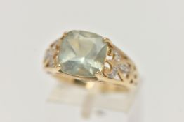 A 9CT GOLD GEM SET RING, designed as a square green gem, assessed as green quartz, in a four claw