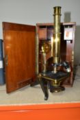 A MONOCULAR COMPOUND MICROSCOPE OF BRASS CONSTRUCTION, impressed Henry Crouch London 8414 to the