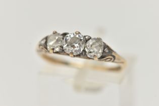 A DIAMOND THREE STONE RING, set with slightly graduating old cut diamonds, the principal diamond
