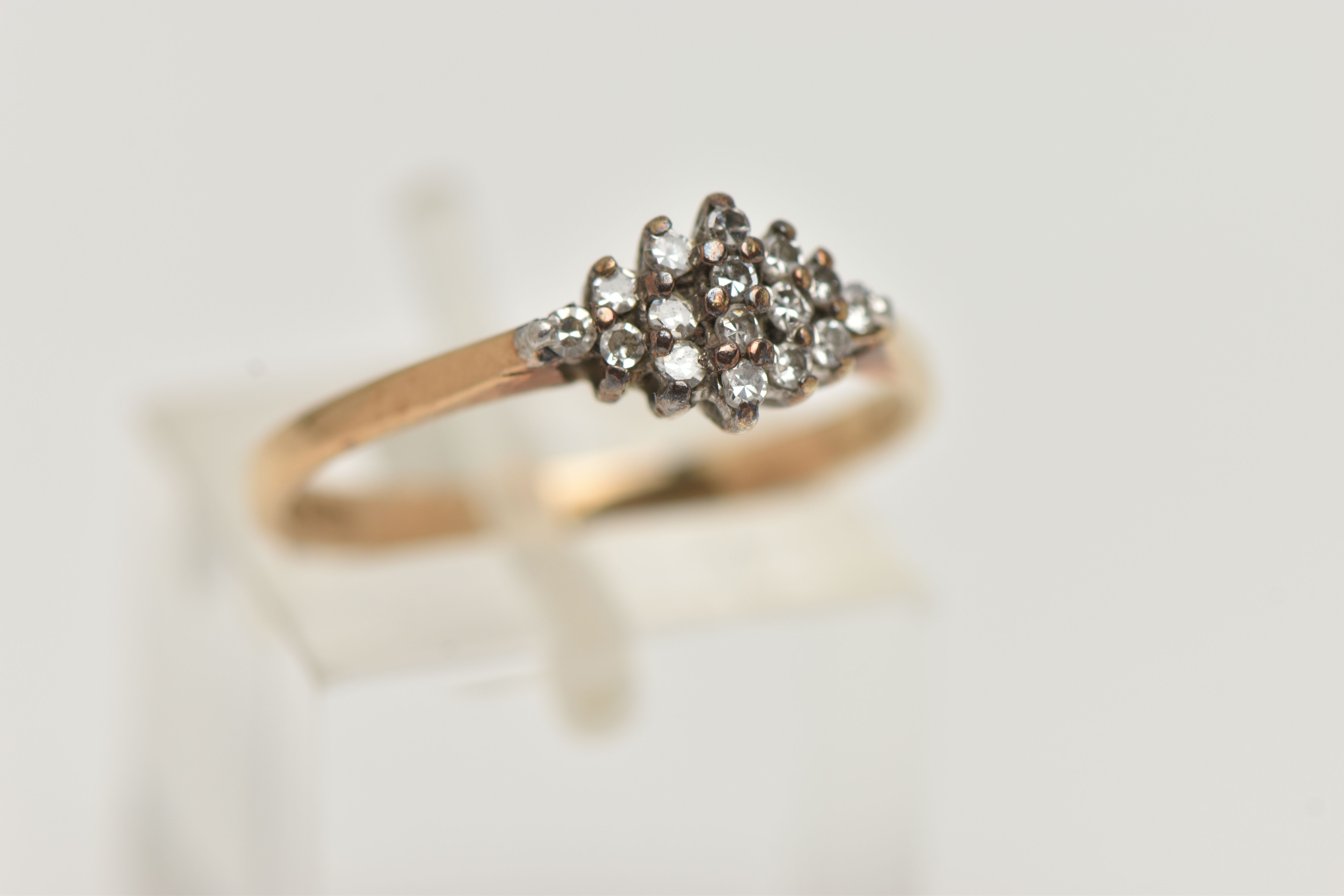 A 9CT GOLD DIAMOND CLUSTER RING, the diamond shape tiered cluster claw set with single cut diamonds, - Image 4 of 4