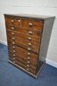 A TALL EARLY 20TH PINE CHEST OF TWO SHORT OVER NINE DRAWERS, with brass scalloped handles, width