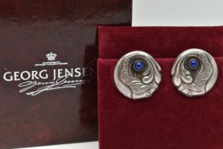 A PAIR OF 'GEORG JENSEN' CLIP ON EARRINGS, circular form earrings, depicting a fish set with lapis