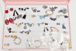 A PINK JEWELLERY DISPLAY BOX WITH EARRINGS, forty eight pairs included, various designs, some pieces