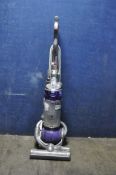 A DYSON DC25 UPRIGHT VACUUM CLEANER (PAT pass and working but brushbar doesn't turn)
