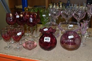 A SELECTION OF COLOURED GLASSWARES, to include six Caithness wine glasses, two tall candlesticks and