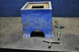 A VINTAGE CAST IRON ANVIL STAND with a 25cm x 26cm recess height 36cm and two anvil stakes