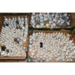 THREE BOXES OF PORCELAIN BELL ORNAMENTS, over two hundred miniature holiday souvenir bells