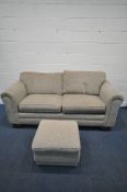 AN OATMEAL UPHOLSTERED TWO PIECE LOUNGE SUITE, comprising a three seater sofa, length 216cm x