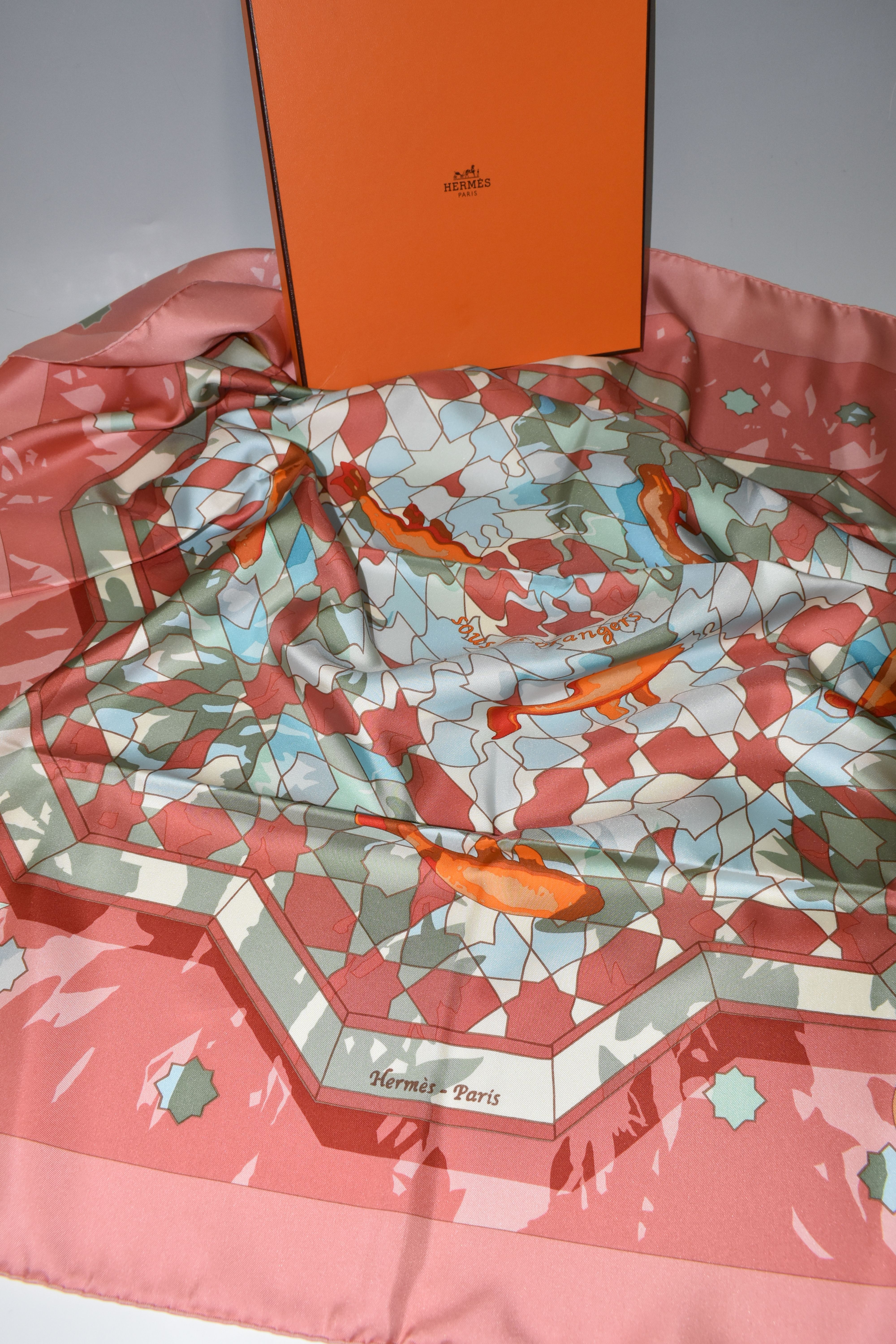 A BOXED HERMÉS PRINTED SILK SCARF, comprising a Dusty Rose/Multi-Col.2 'Sous Les Orangers' design