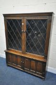 POSSIBLY NIGEL/RUPERT GRIFFITHS, A 20TH CENTURY OAK LEAD GLAZED TWO DOOR BOOKCASE, over double
