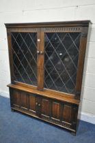 POSSIBLY NIGEL/RUPERT GRIFFITHS, A 20TH CENTURY OAK LEAD GLAZED TWO DOOR BOOKCASE, over double