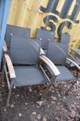 A SET OF FOUR TEAK AND STAINLESS STEEL GARDEN CHAIRS width 66cm Condition Report: some paint