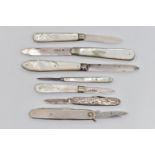 FIVE FRUIT/POCKET KNIVES AND TWO OTHERS, four fitted with silver blades and mother of pearl handles,