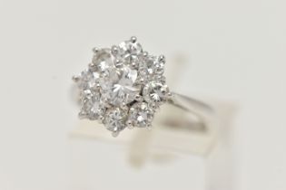 AN 18CT GOLD DIAMOND CLUSTER RING, nine round brilliant diamonds, approximate total diamond weight